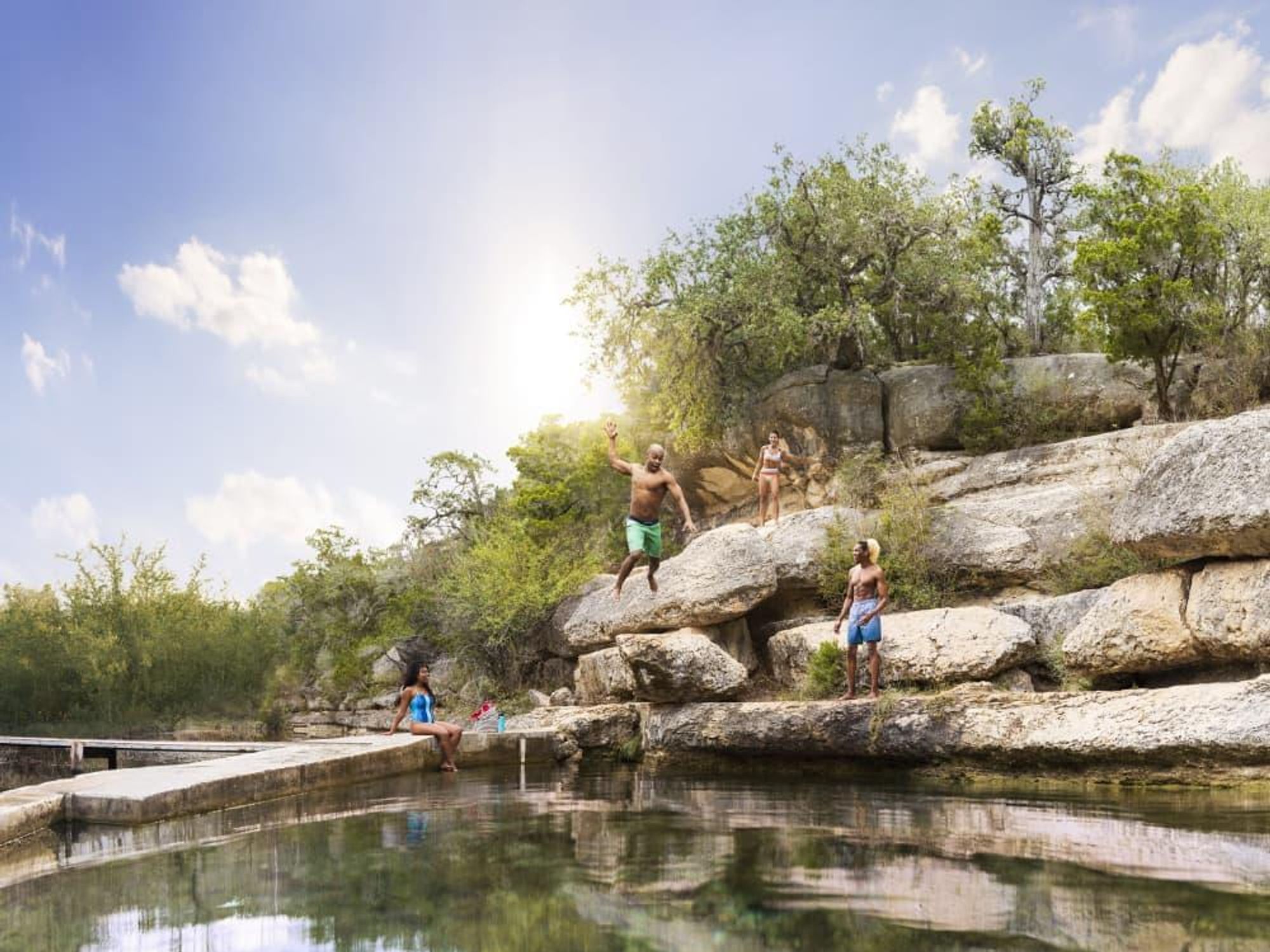 People jumping off Jacob's Well cliff