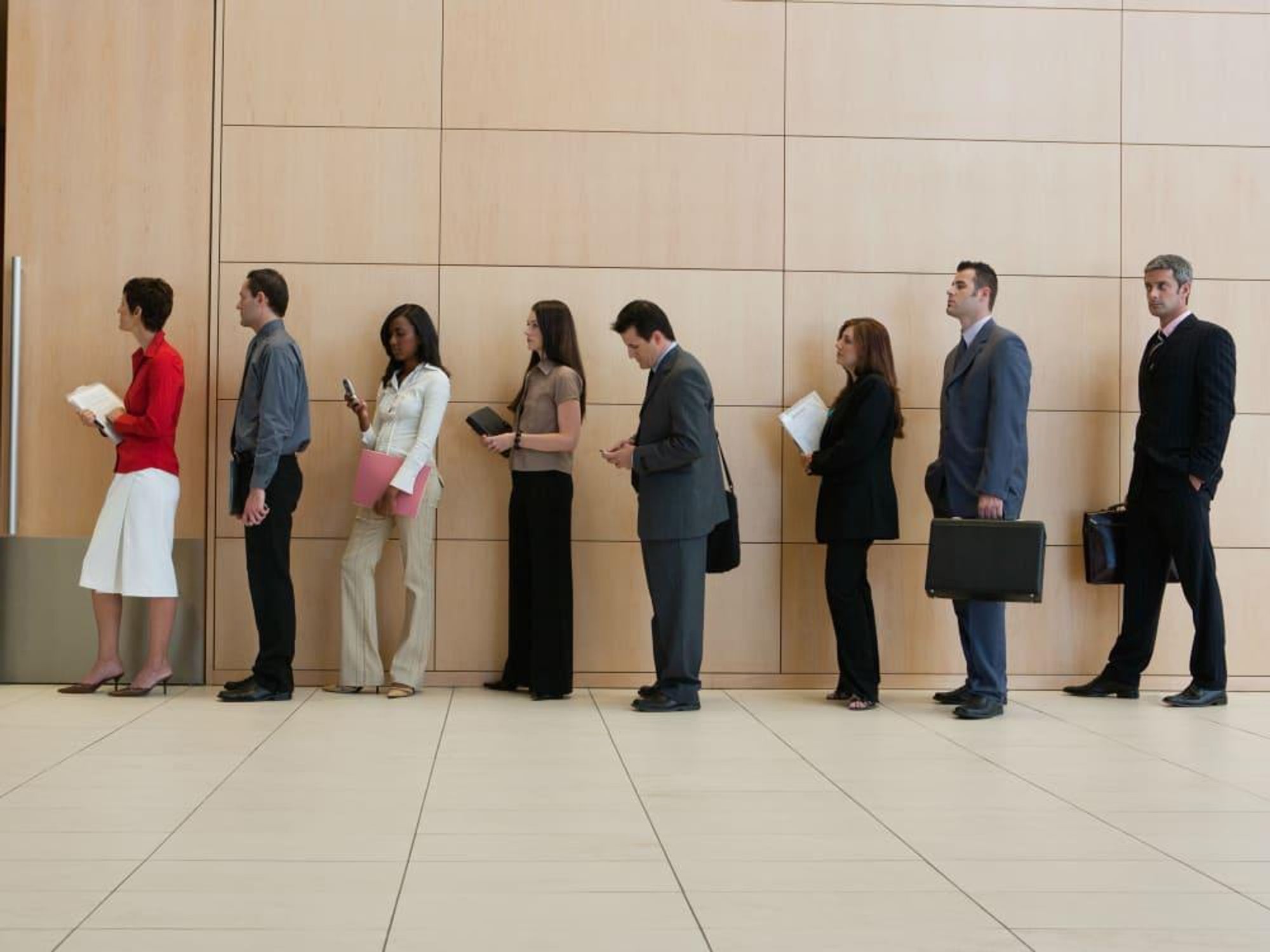 people standing in line waiting in line office