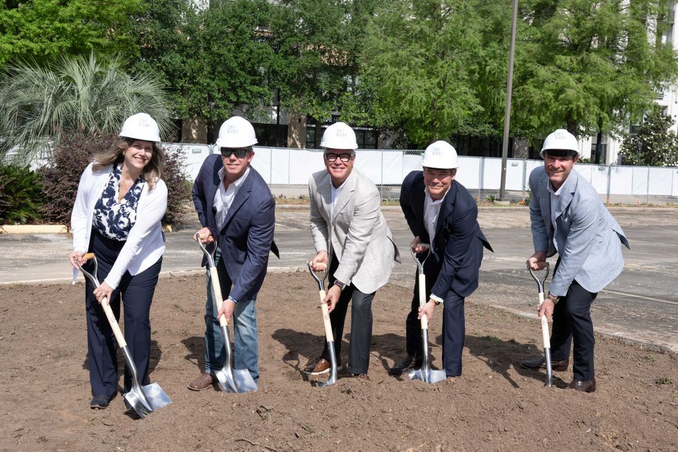Photo of a group of people with shovels digging into the dirt at a groundbreaking for 2811 Kirby and The Lily River Oaks