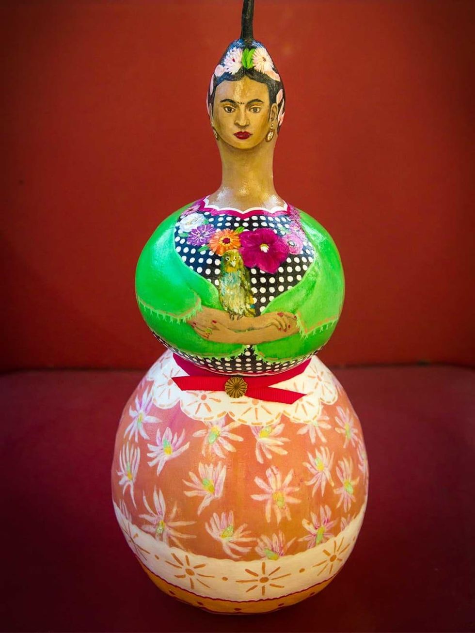 Photo of painted gourd doll created by Allee Brand