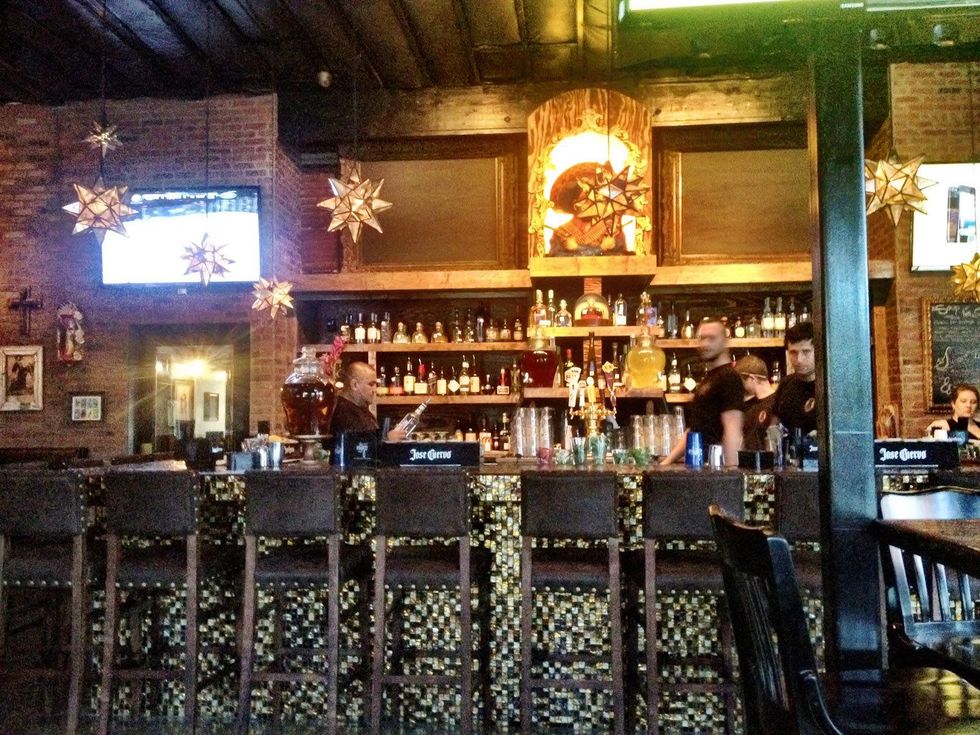 Pistolero's fully stocked bar and mosaic tile