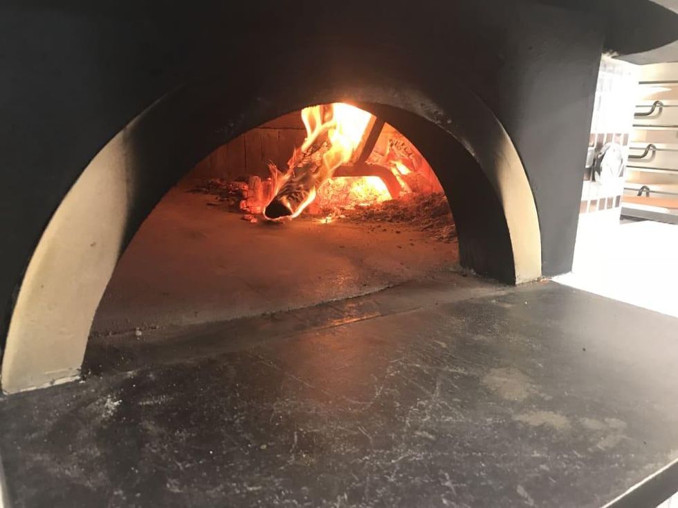 Pizaro's Memorial wood fire