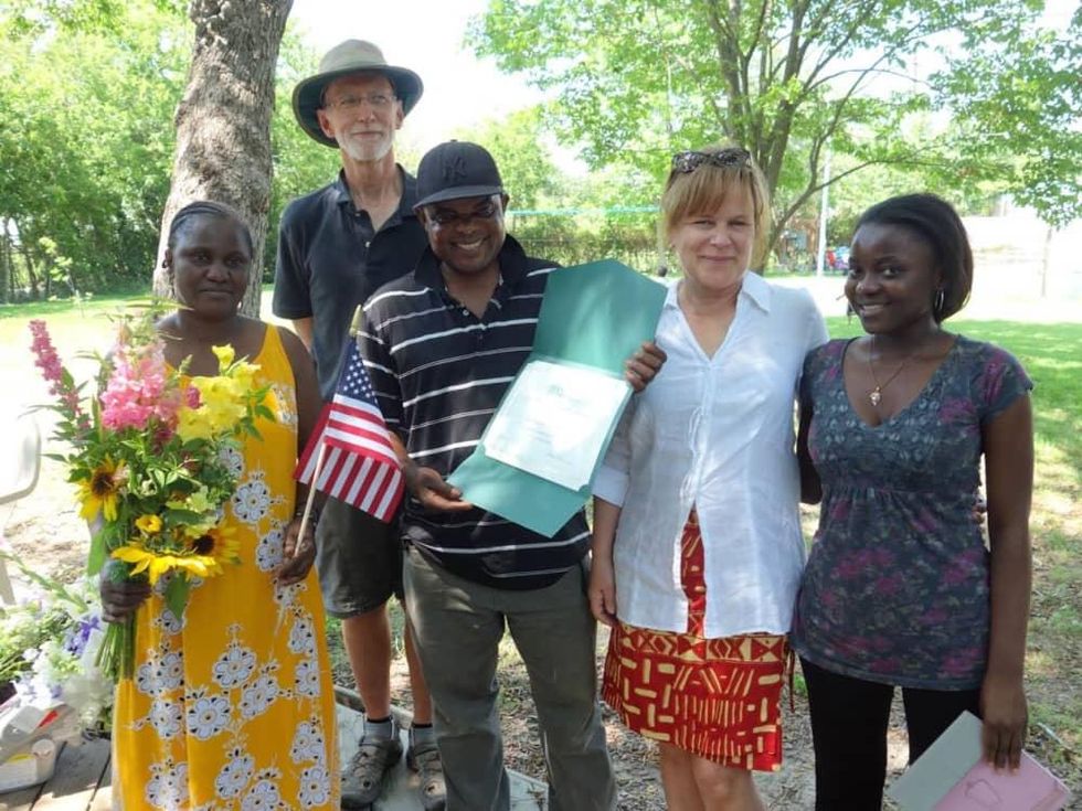 Plant It Forward president Teresa O'Donnell In white blouse with graduates from training program