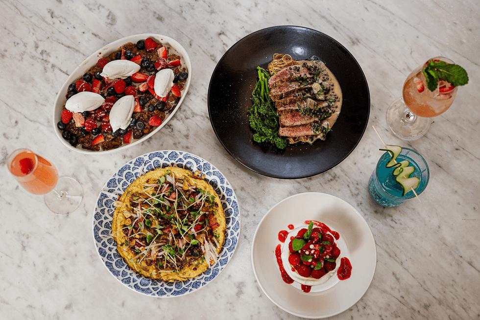 Plates of French toast, veal and a variety of cocktails.