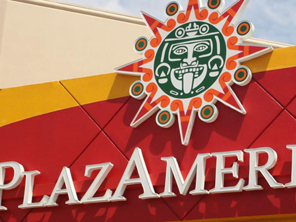 PlazAmericas logo Aztec sun sign