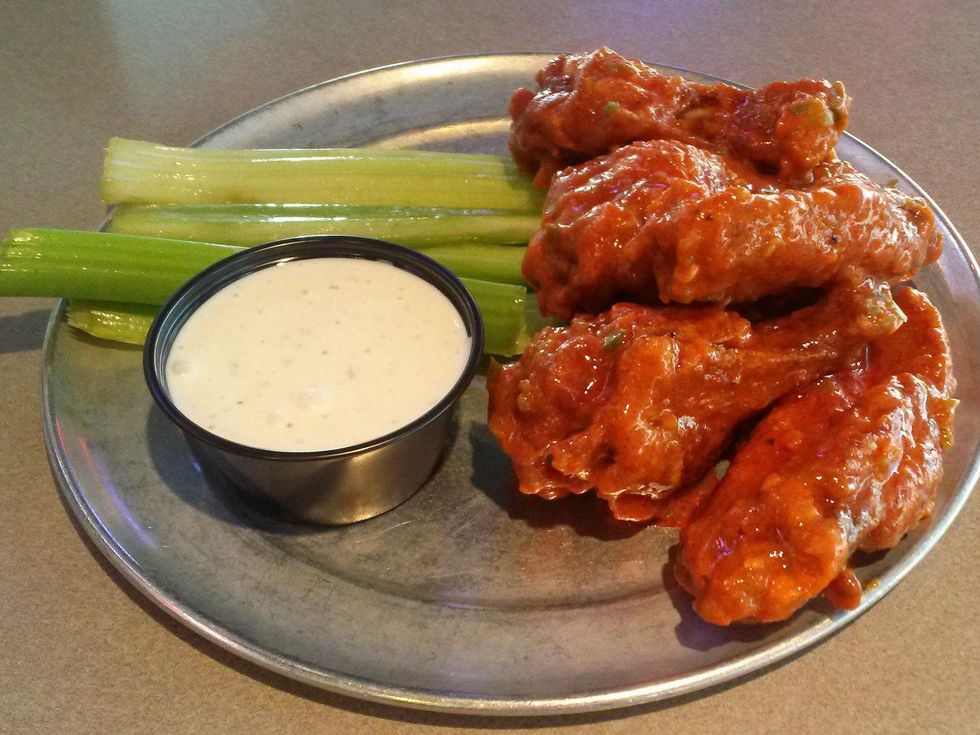 Pluckers Wing Bar celery with dip and chicken wings