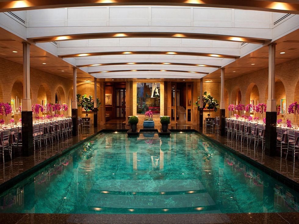 pool in center with dinner tables on either side at the Asprey dinner October 2013