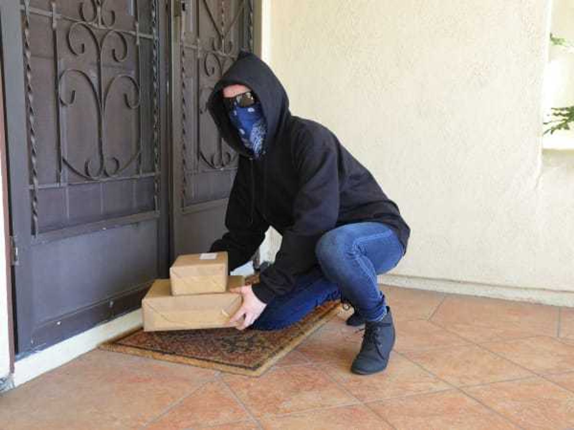 Porch Pirate Person in Glasses Steals Packages