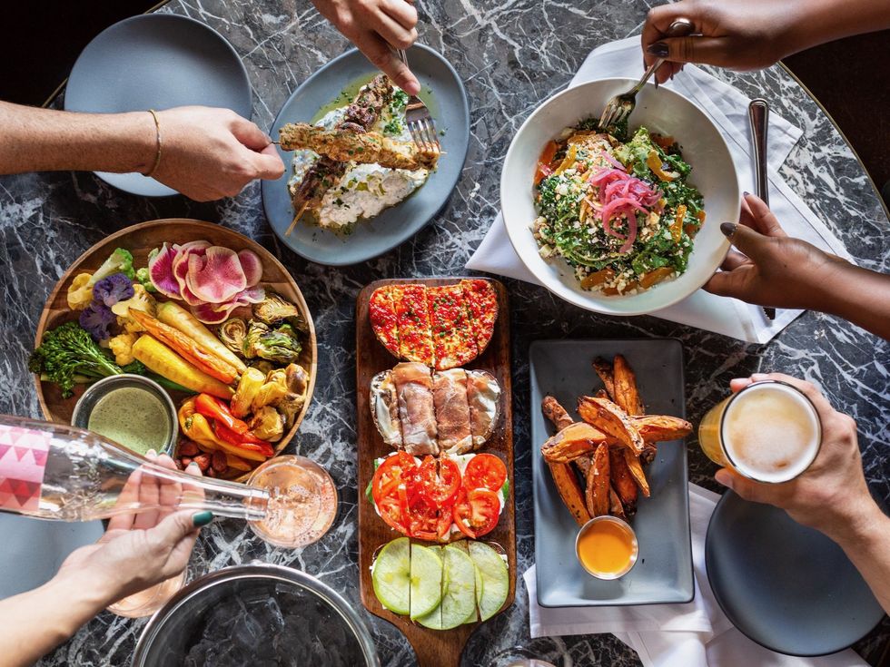 Buzzy wine barcafehappy hour fave tips hat to Houston icon Howard