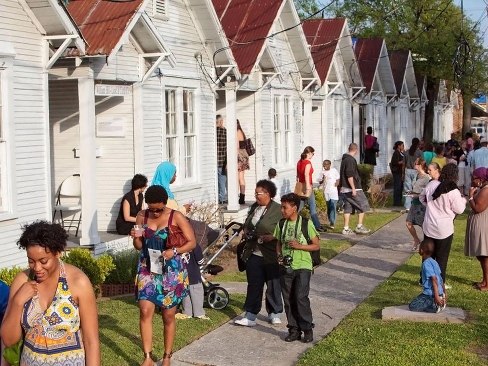 Project Row Houses with people walking outside day