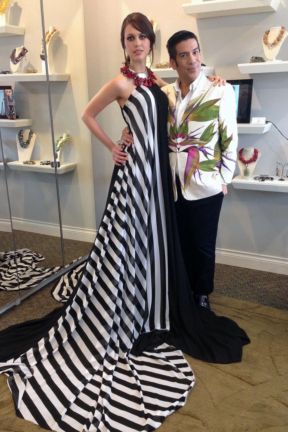 Project Runway's Daniel Esquivel with model in Austin Fashion Week dress