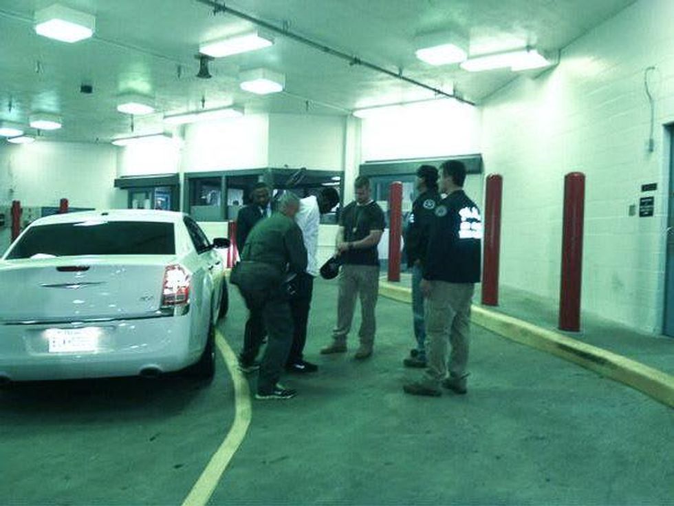 Quanell X and La-Melvin D. Johnson turn in after declaring self-defense in car wash shootings October 2013