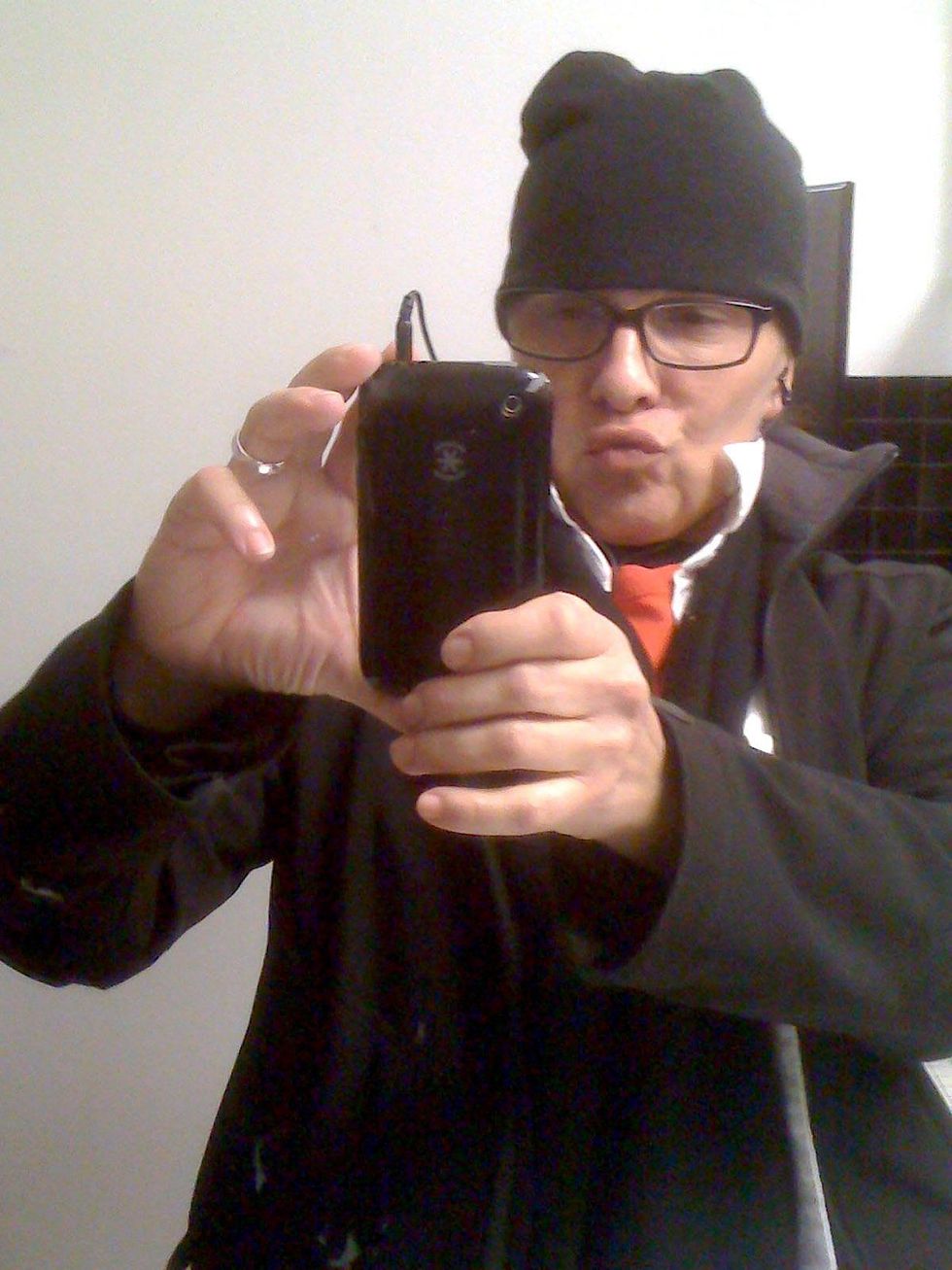 Rachel Hecker, head shot, with camera