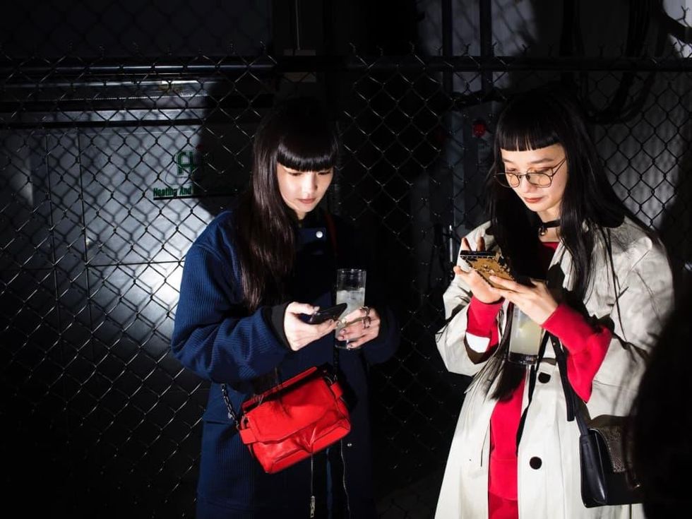 Rag & Bone party guests texting