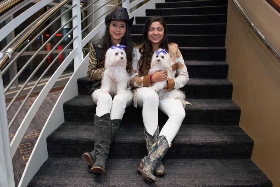 Regina Valdes with Luna, from left, and Alexa Biendis with Fendi at the Citizens for Animal Protection Gala November 2014