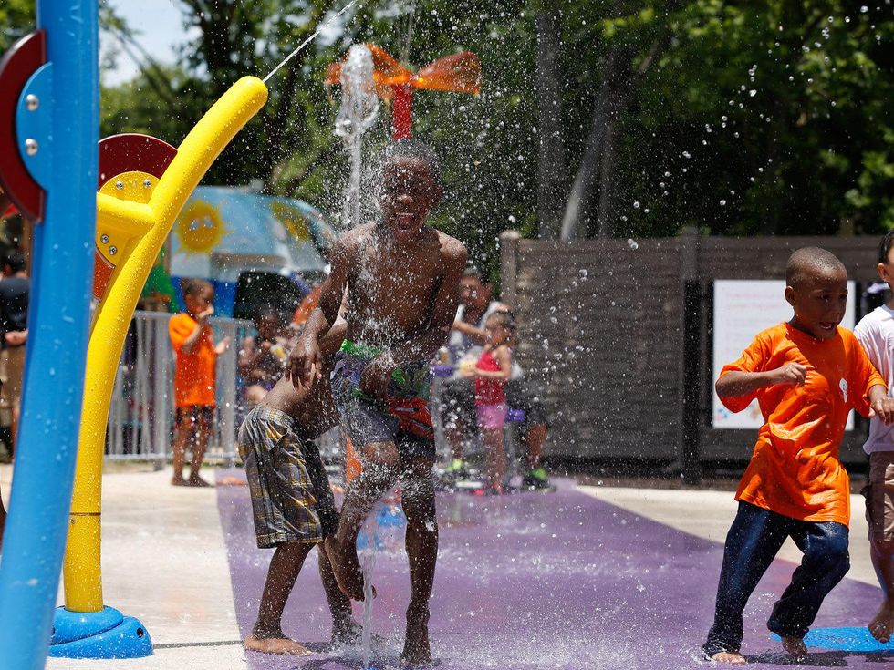 Reliant Solar Splash Pad children playing in water