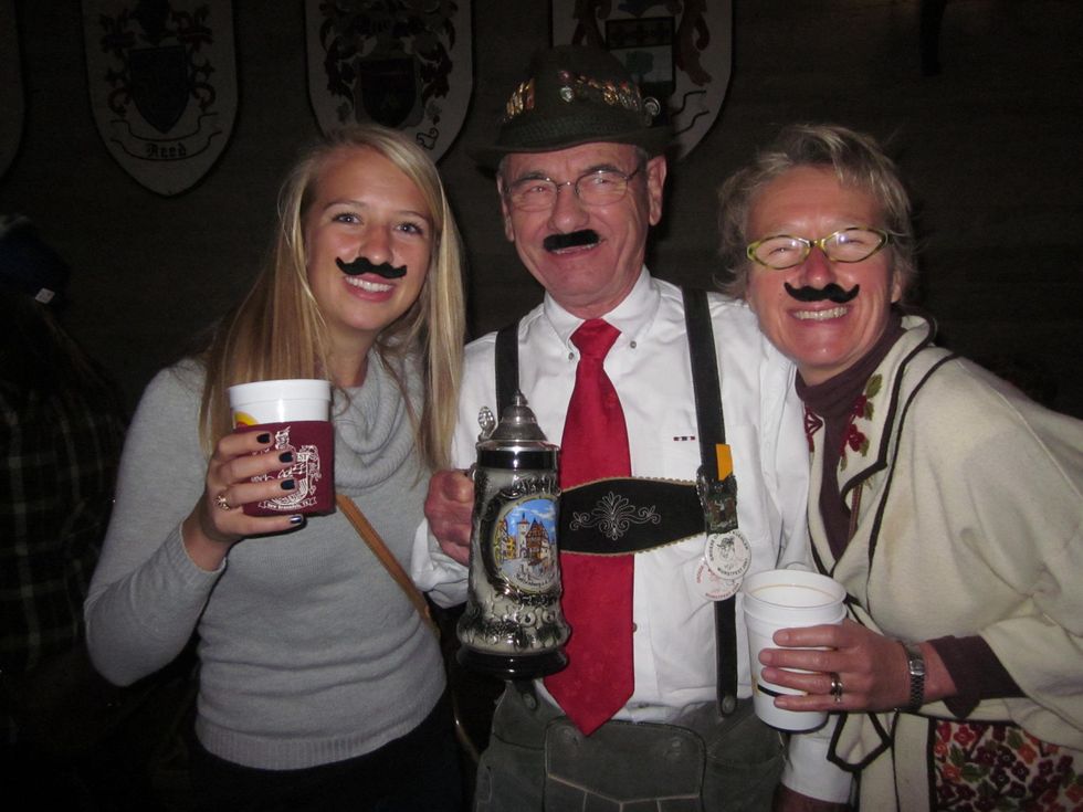 Revelers wearing mustaches at Wurstfest in New Braunfels