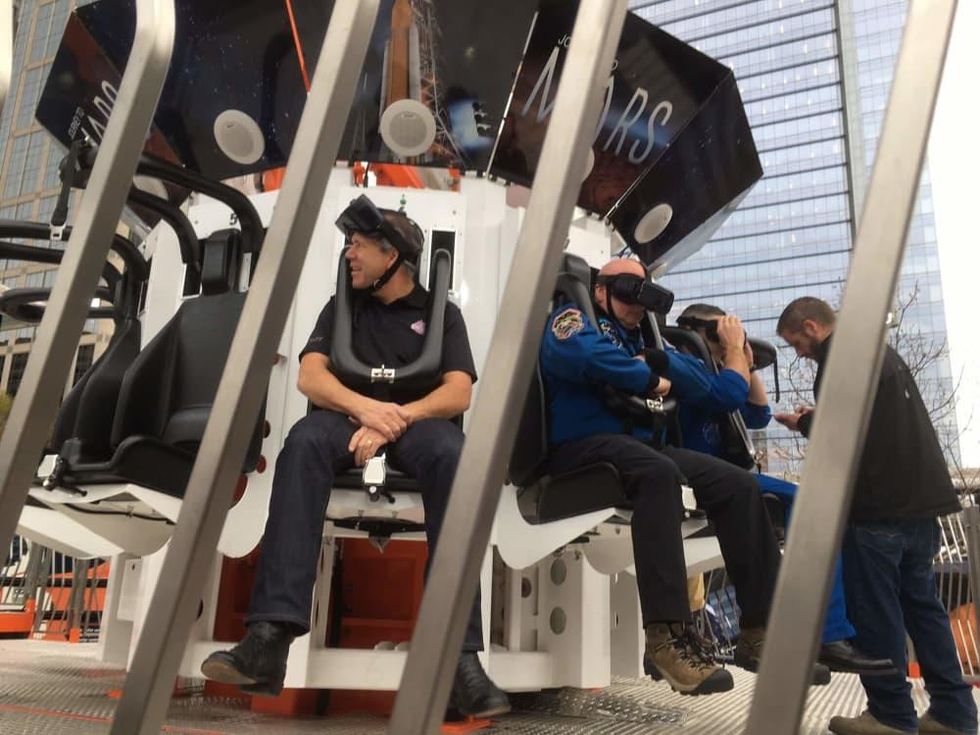 Ric Campo and Scott Kelly wait to being the Future Flight ride at Discovery Green