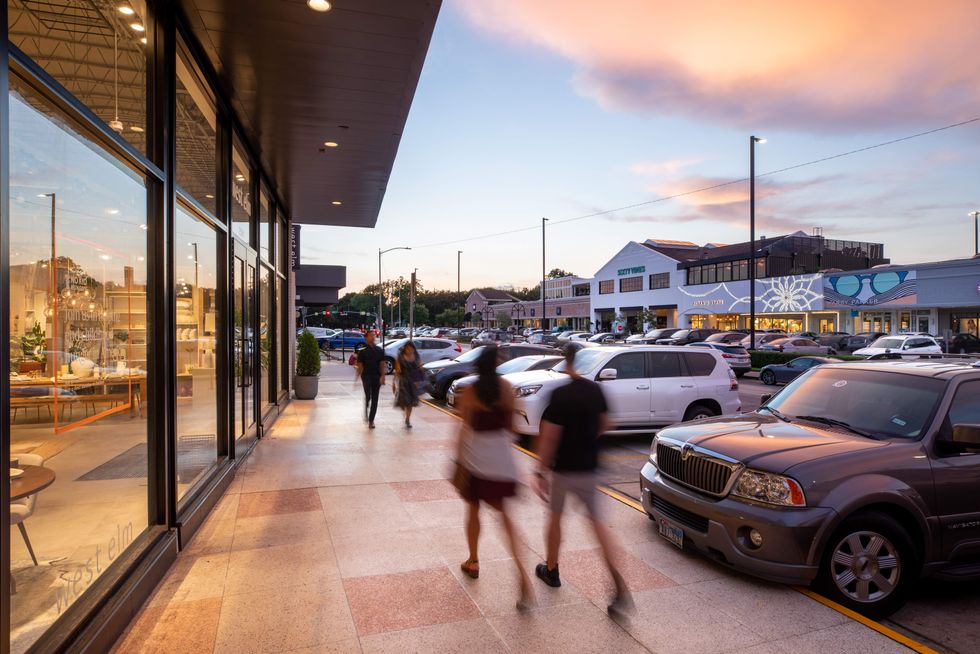 RIce Village at dusk with shoppers walking around