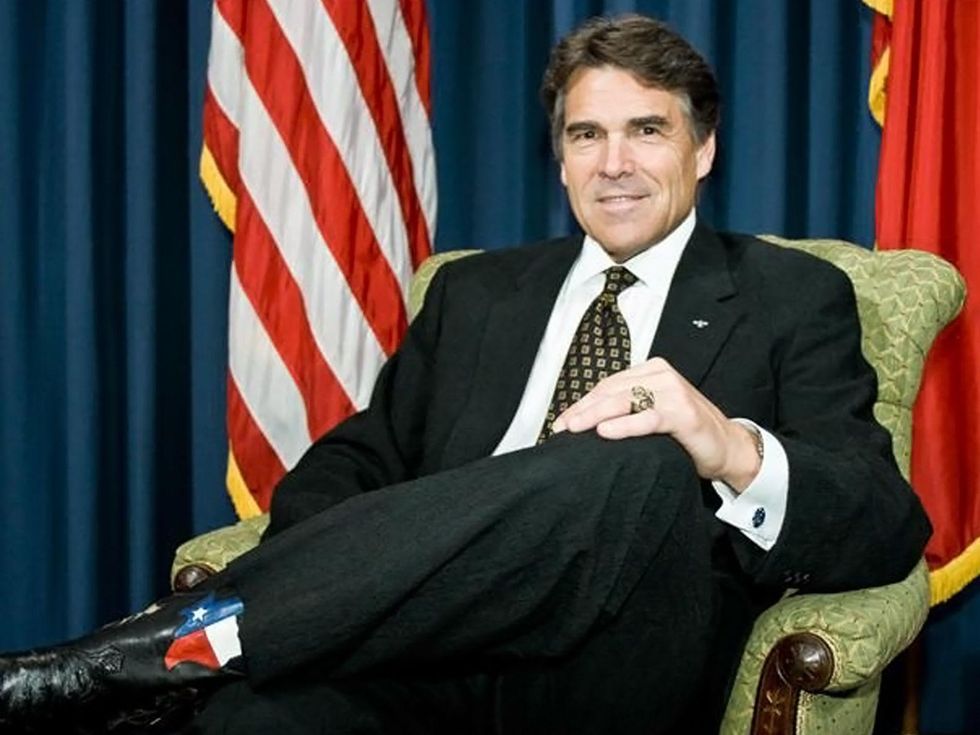 Rick Perry wearing cowboy boots and a suit