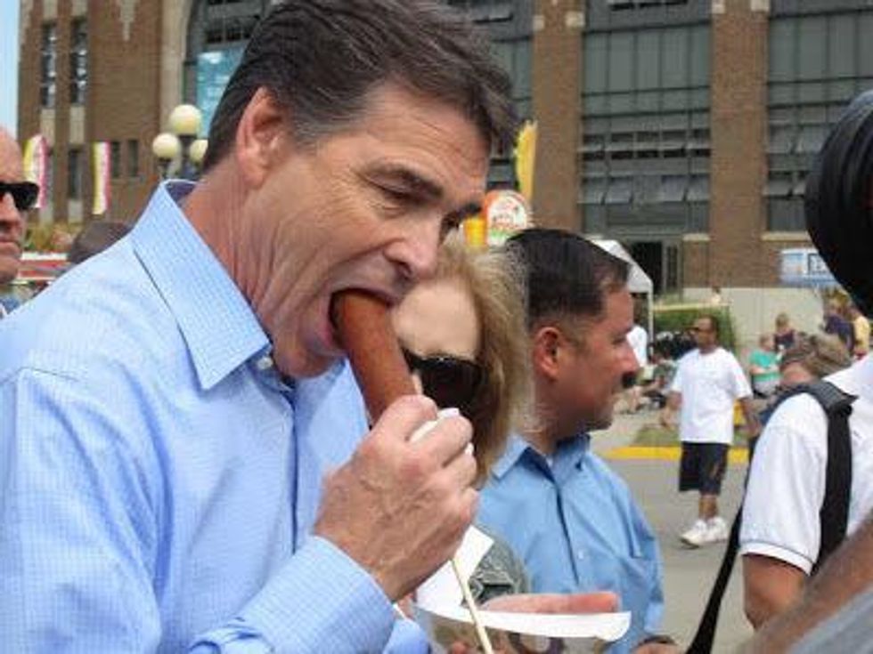 Rick Perry with corn dog at Iowa State Fair