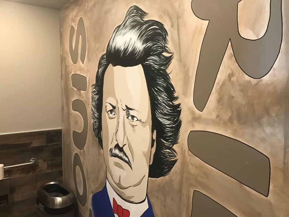 Riel restaurant men's bathroom mural
