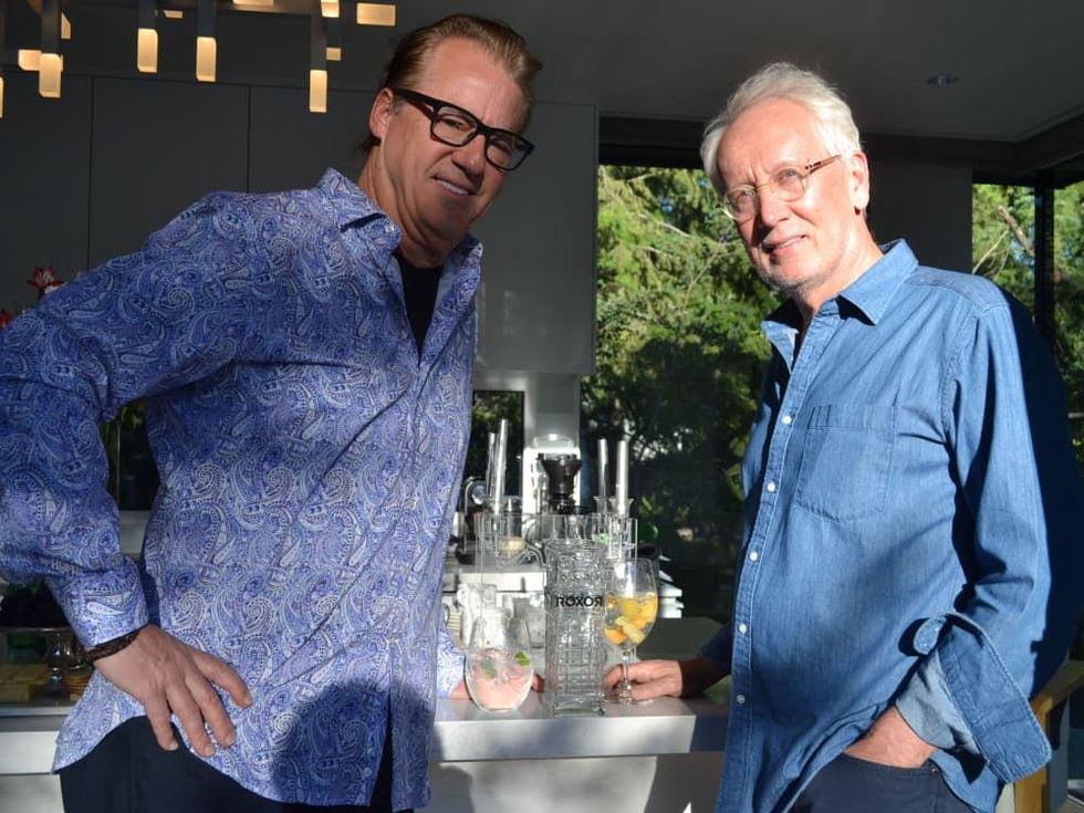 Robert Del Grande and Don Short with a bottle of Roxor Gin at Aspen Food & Wine festival