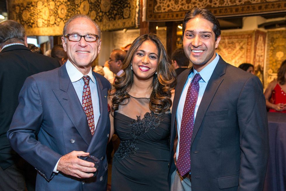 Robert Sakowitz, from left, with Rachel and Raj Duvvuri at the Abraham's Oriental Rug dinner September 2014