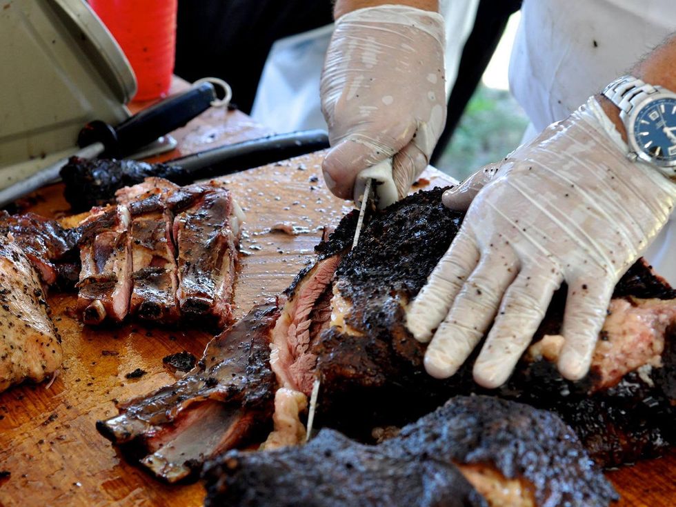 Ronnie Killen Killen's barbecue cutting meat August 2013