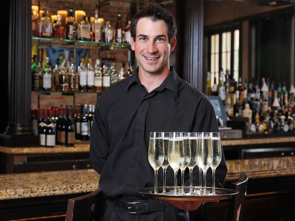 Ruth's Chris Houston steak cutting July 2013 bartender with champagne