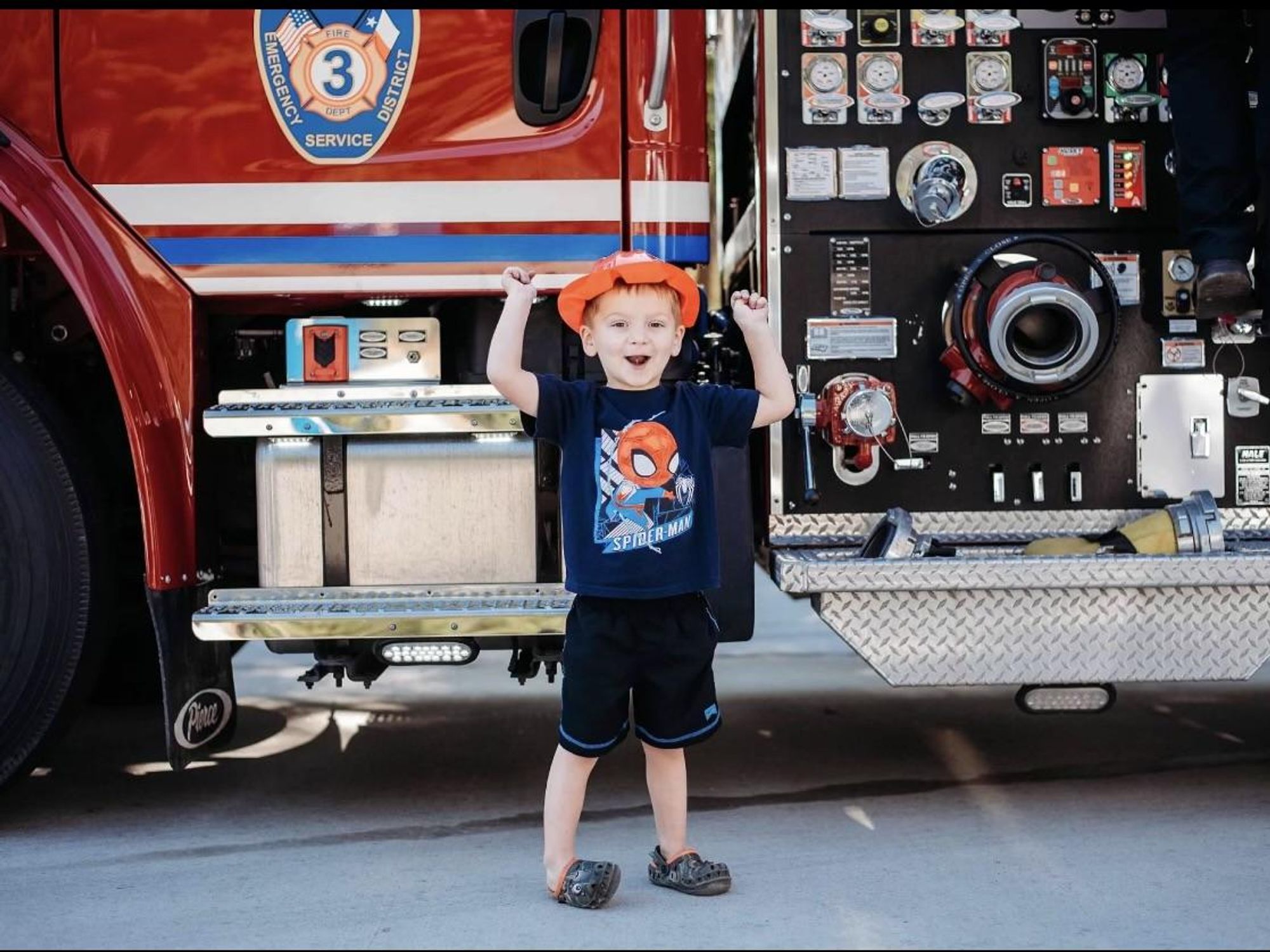 Ryer Lindner in front of fire truck