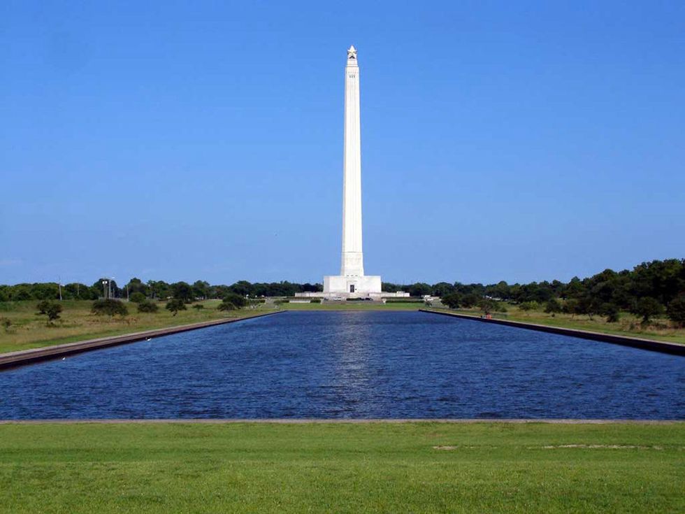 San Jacinto Monument with lake in foreground