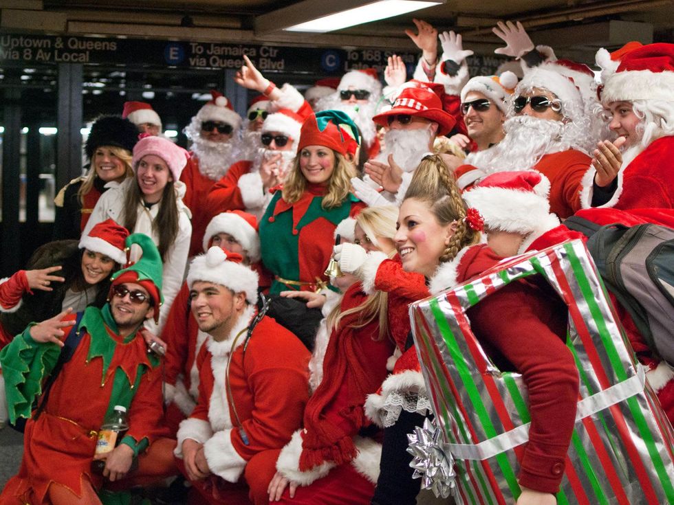 SantaCon New York City group posing in station