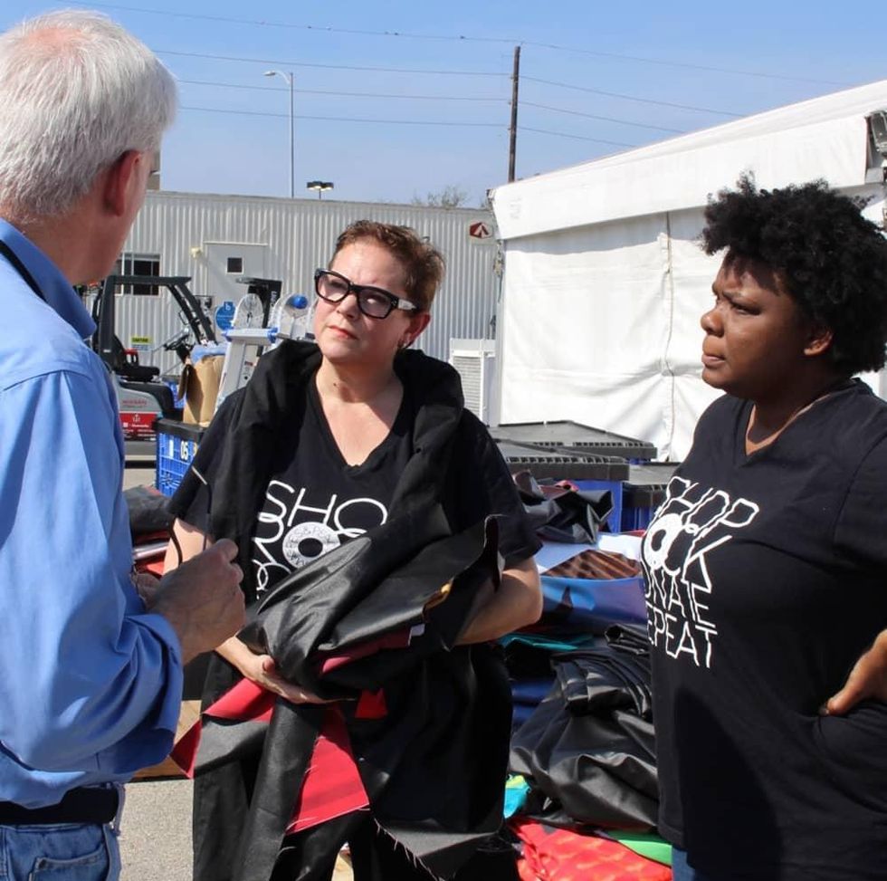 Sarah-Jayne Smith and Ahshia Berry picking up post-consumer Super Bowl material from NRG Stadium