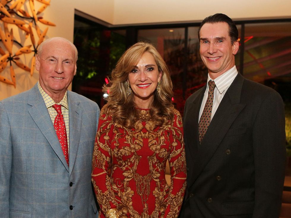 Scott and Jana Arnoldy, from left, with Todd Waite at the Alley Theatre Board Holiday Party December 2013