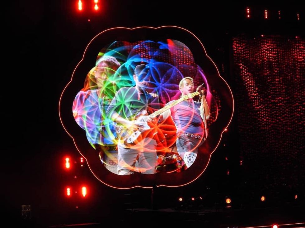 Screens on either side of stage at Coldplay concert offered interesting scenes