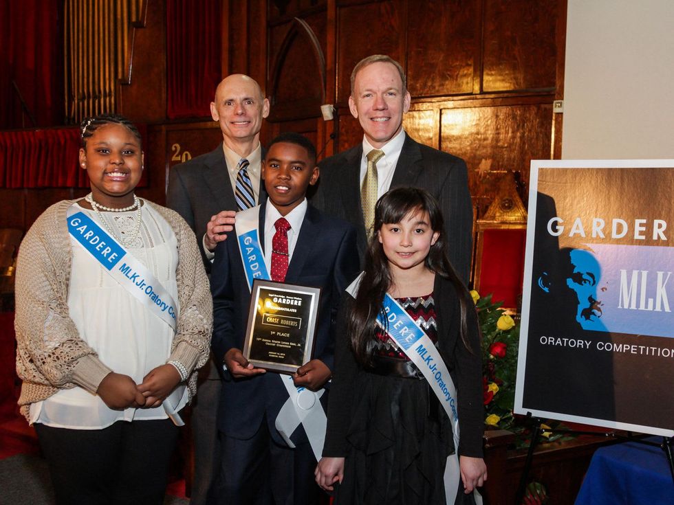 Second-place winner Shakeira Hayes, 5th grader from Pleasantville Elementary; Event Chair and Gardere Operating Partner Claude Treece; First-place winner Chase Roberts, 5th grader from Cornelius Elementary; Gardere Partner Stephen Moll; Third-place winner