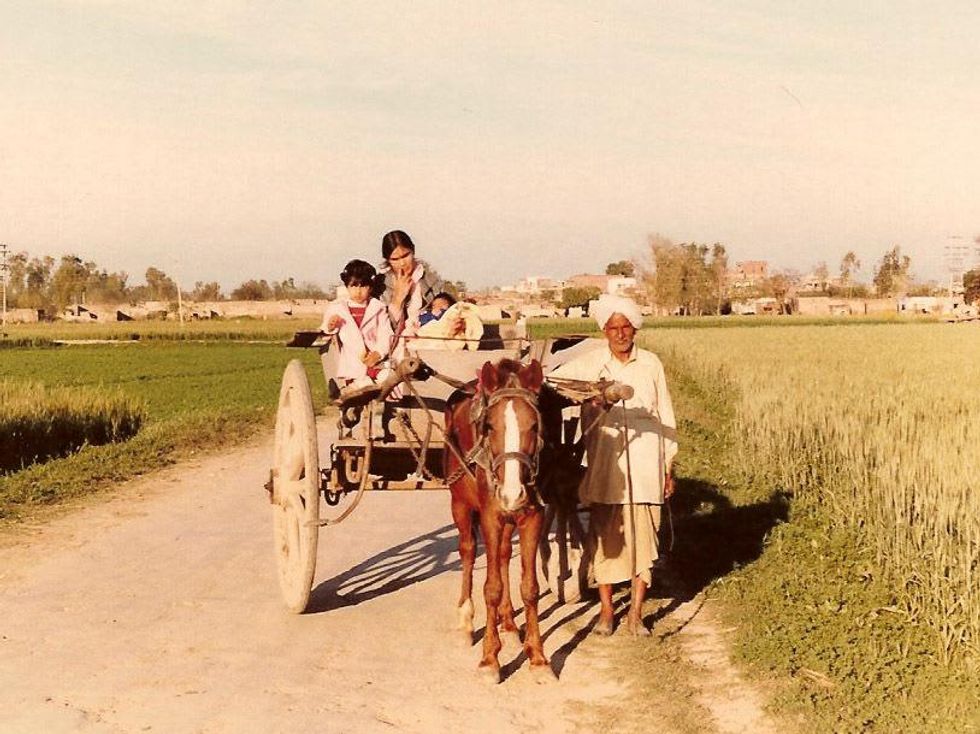 Shubhra Ramineni 1981 India - path through village grain fields with Mom and baby brother