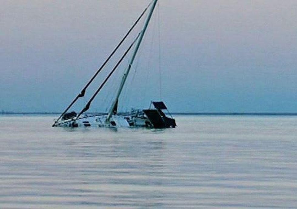 sinking sailboat in galveston bay