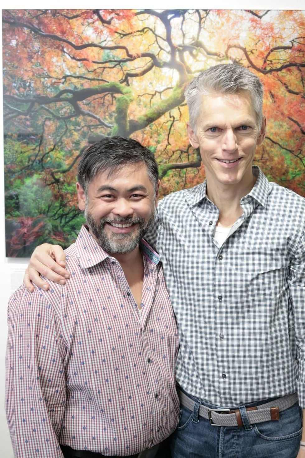 Sixto Wagan (left) poses with Matthew Dirst (right) at Art on the Avenue Preview Party