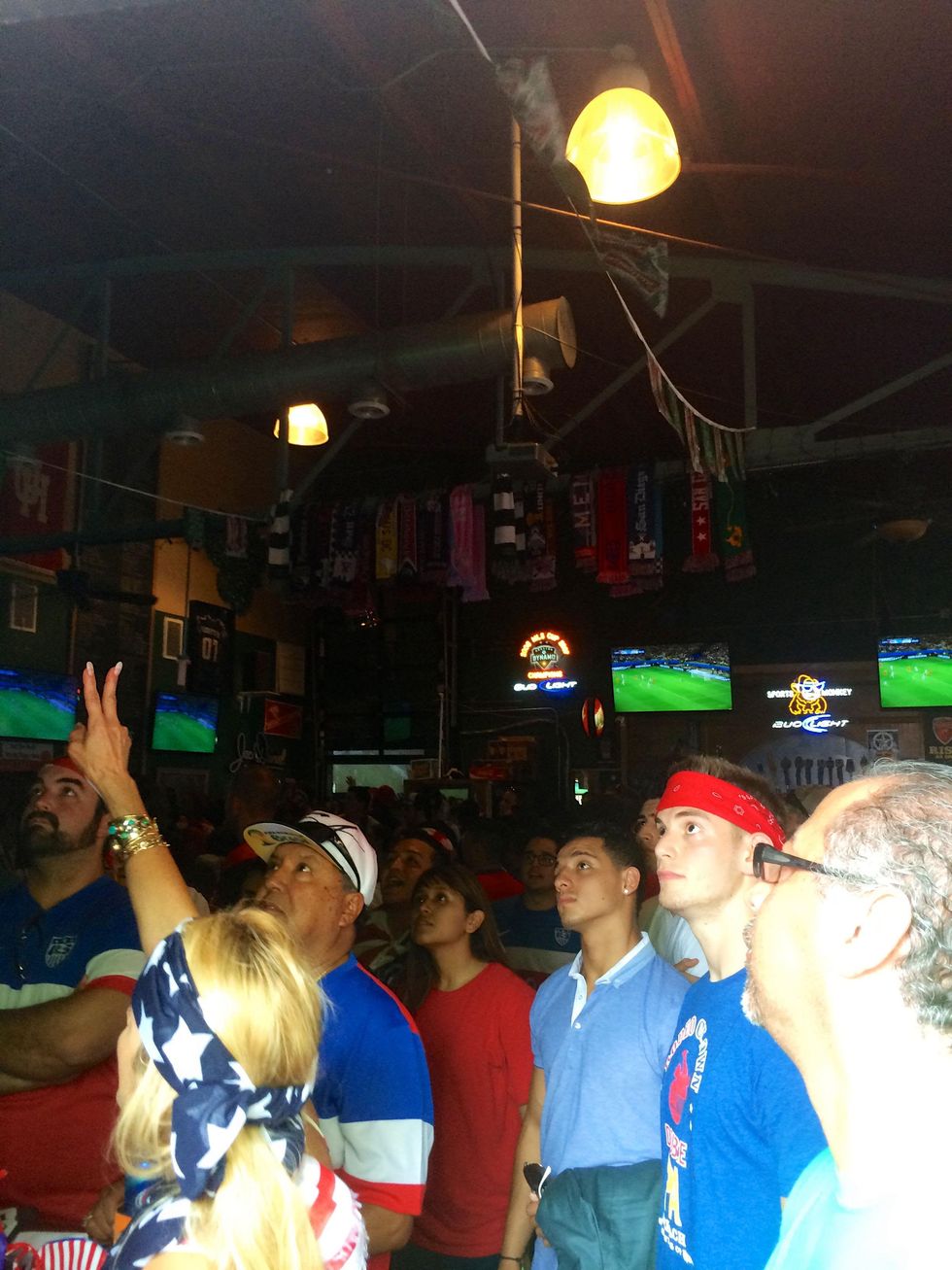 Soccer fans in Lucky's Pub watching the USA vs. Belgium soccer game.
