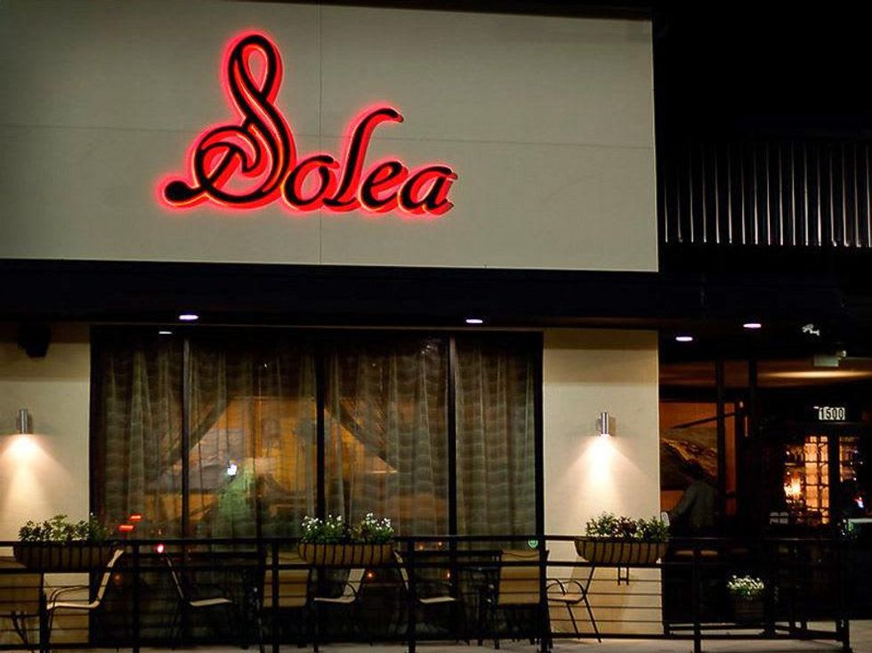 Solea Cafe Houston exterior night with neon sign