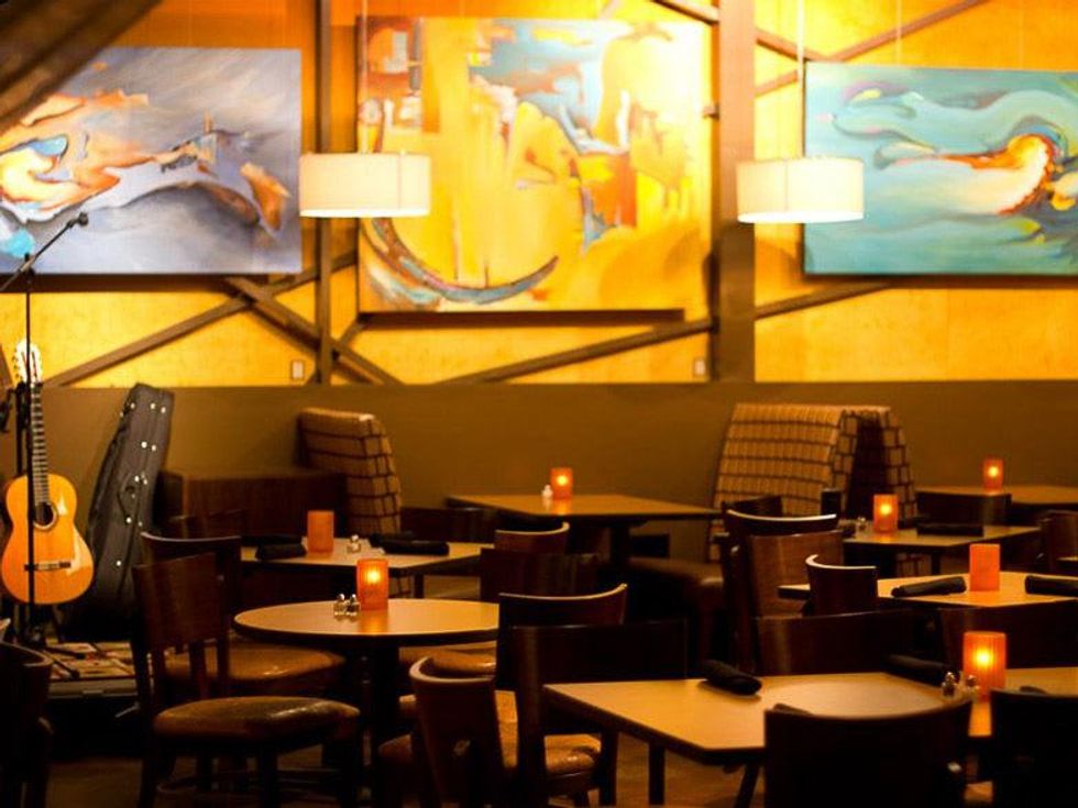 Solea Cafe Houston interior with candles and artwork