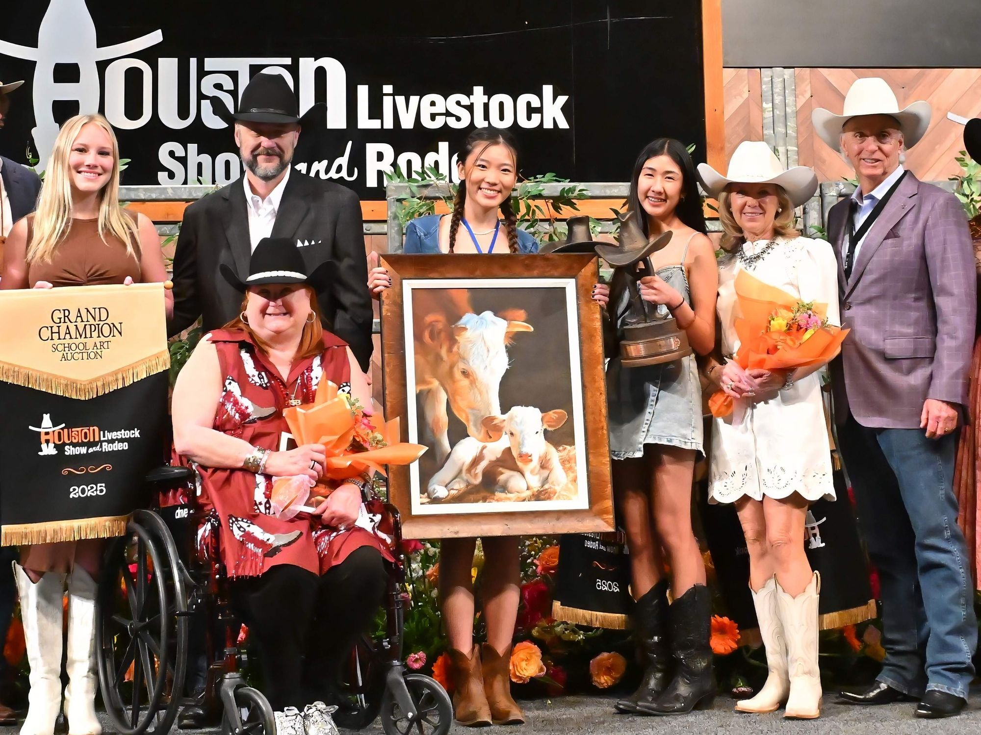 Sophie Zhou holds up her painting "Nurture."