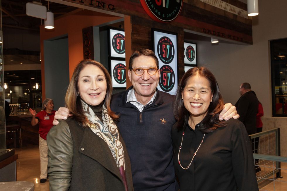 Soraya and Scott McClelland, left, with Grace Kim at the H-E-B San Felipe and Table 57 Social February 2015