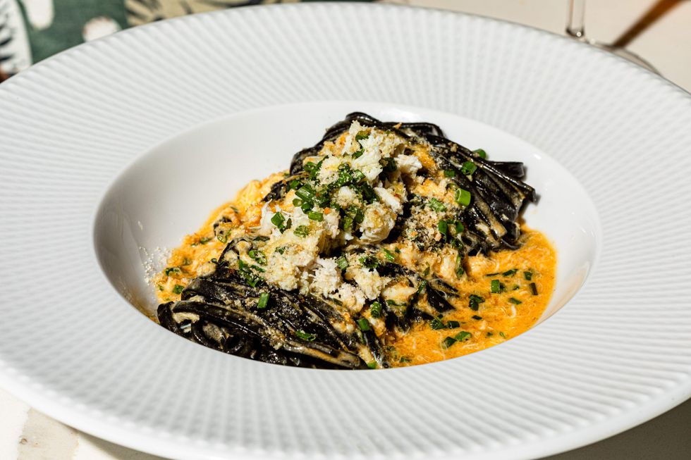 Squid ink pasta topped with fresh crab meat