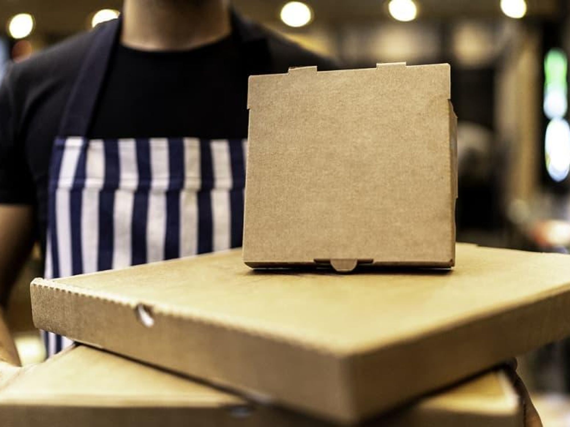 Stack of pizza take-out boxes