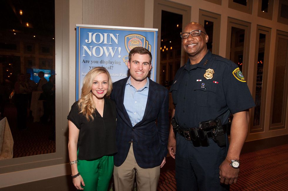Stacy and Jason Johnson, from left, with Charles McClelland at the Houston Police Department benefit April 2015