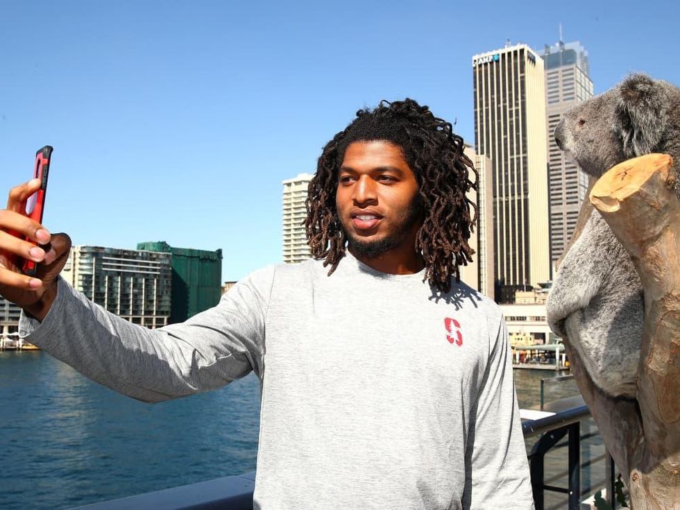 Stanford player Peter Kalambayi and koala in Sydney Australia