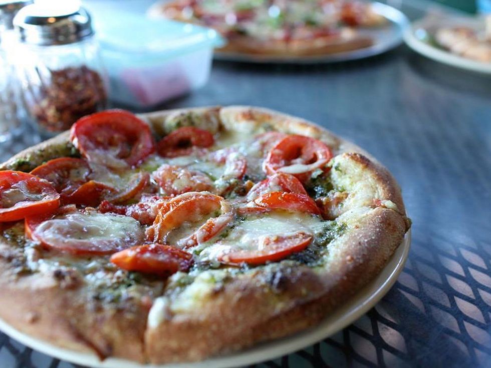 Star Pizza Houston pizza on patio table